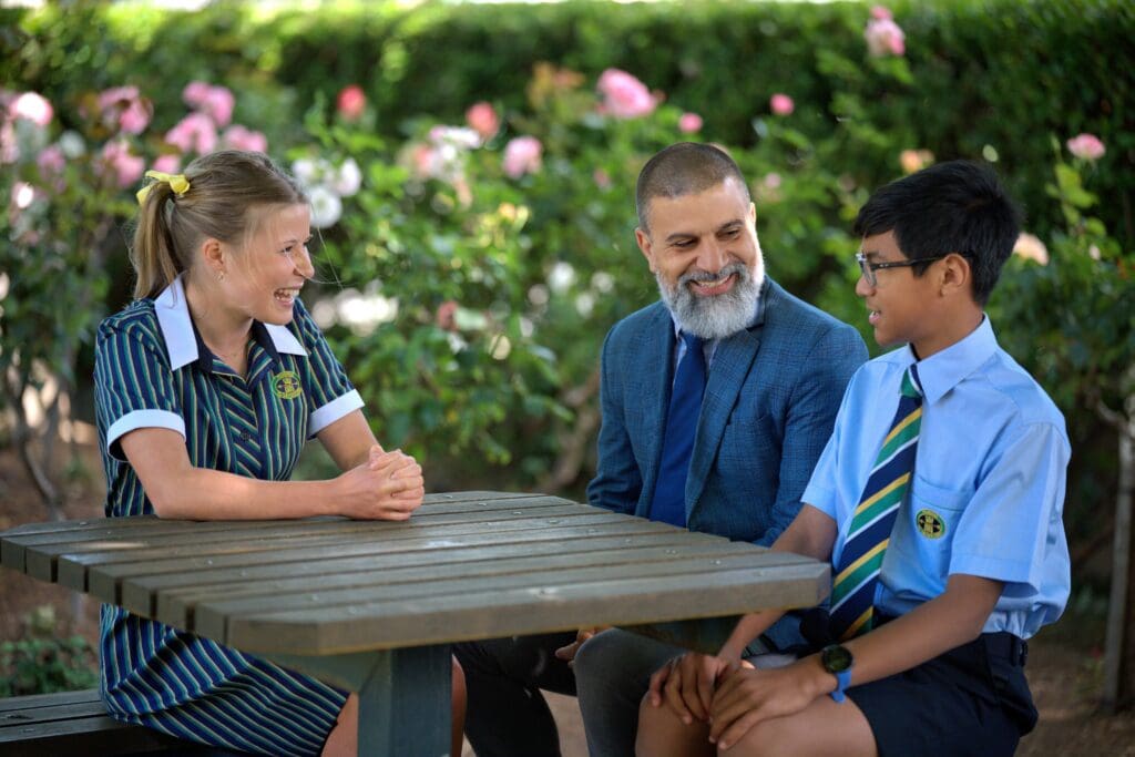 Lawrence pascale head of middle school with two students