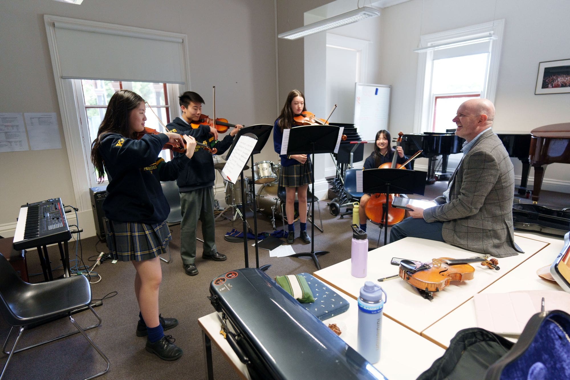 Artist in Residence, Dr Julian Ferraretto, rehearsing with students before the 2026 Music Showcase.