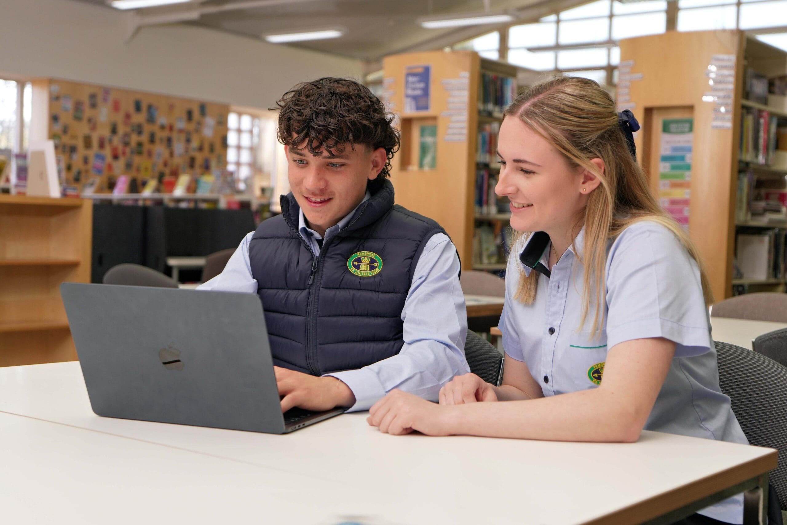 two senior school students in the library 