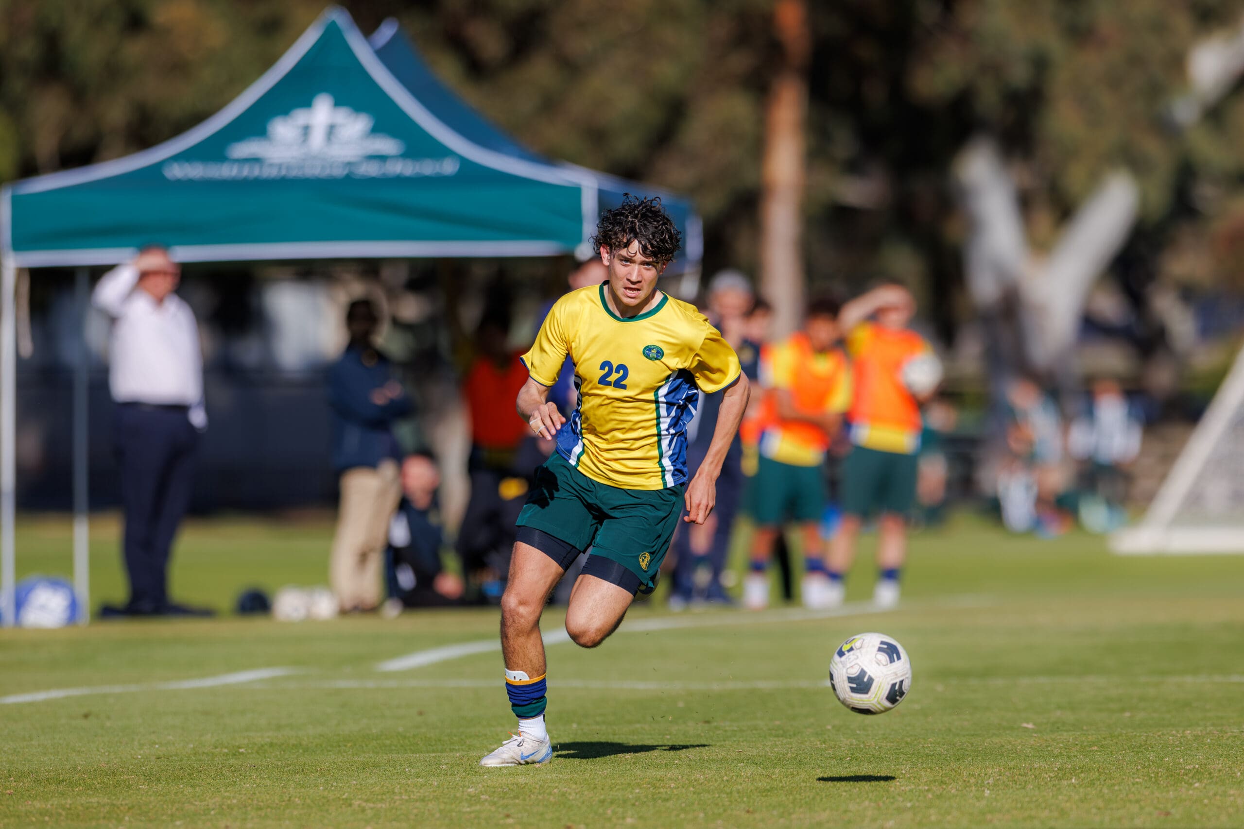 student playing football during 2025 insterschool