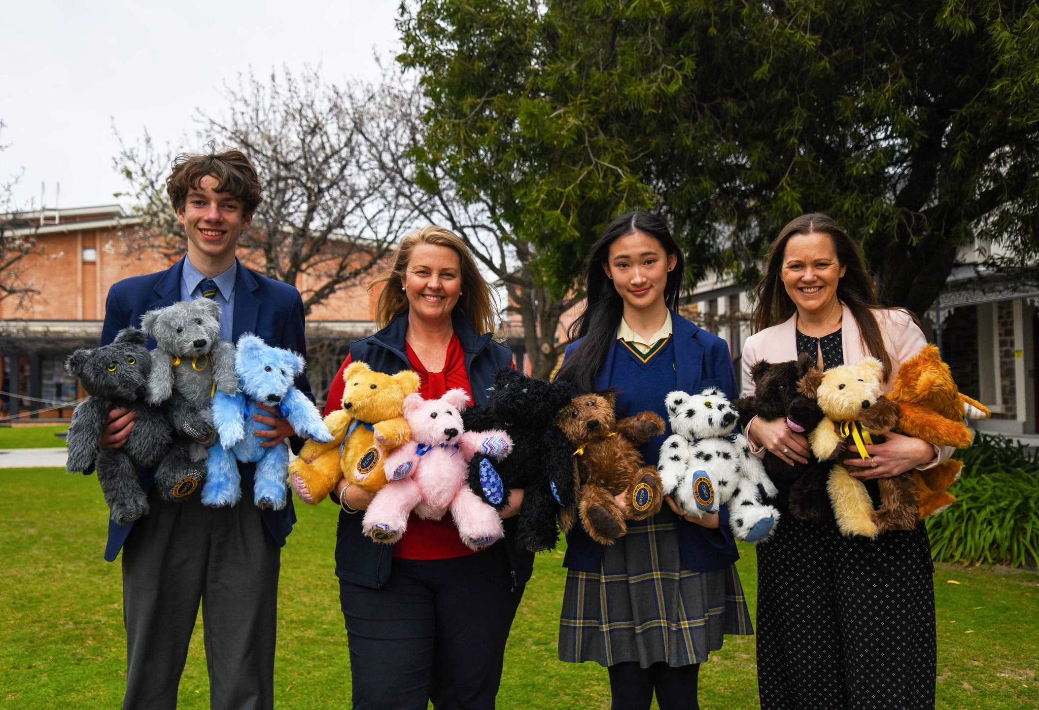 pembroke students and staff posing with teddy bears