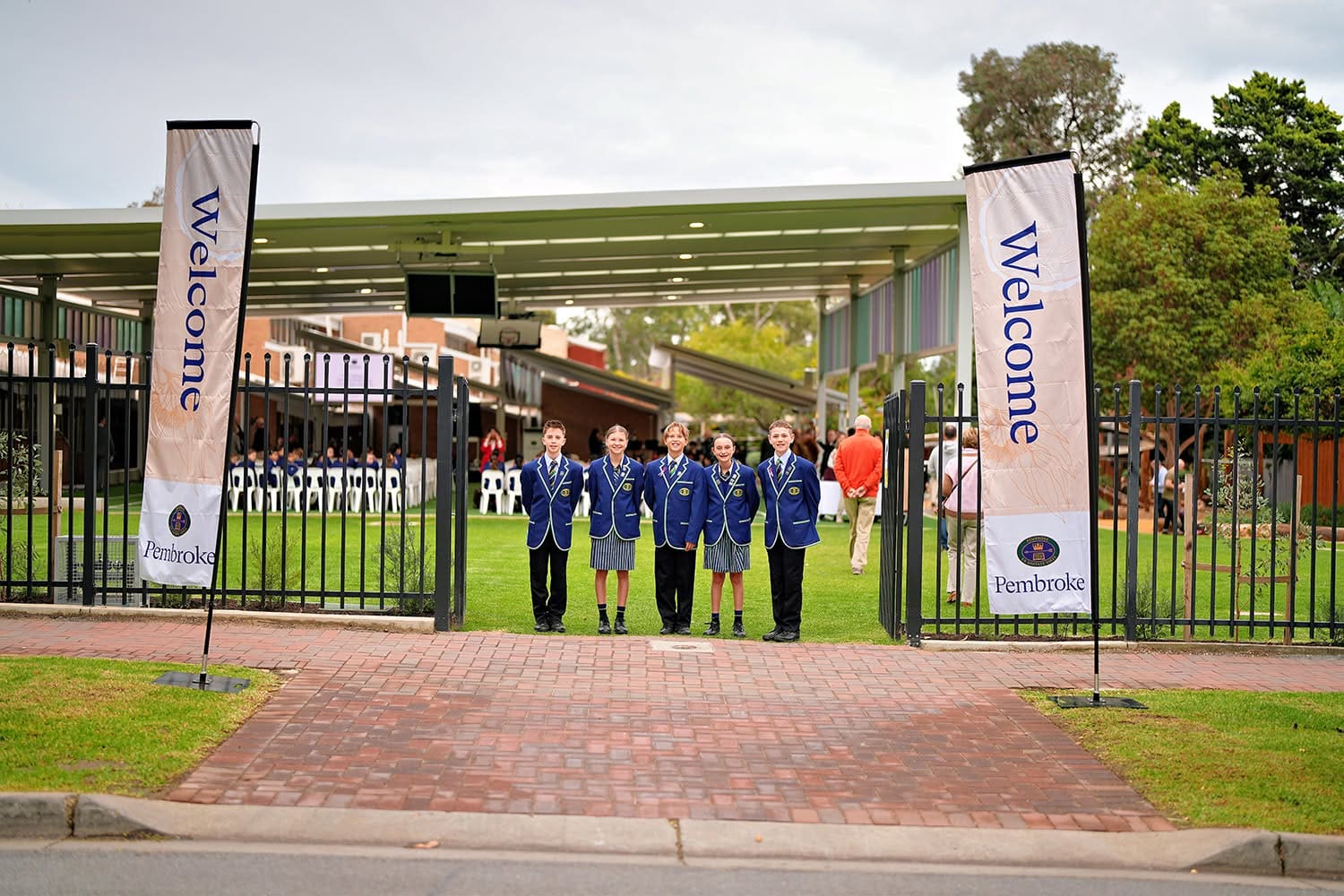 junior school students welcoming parents to the opening of the new playground