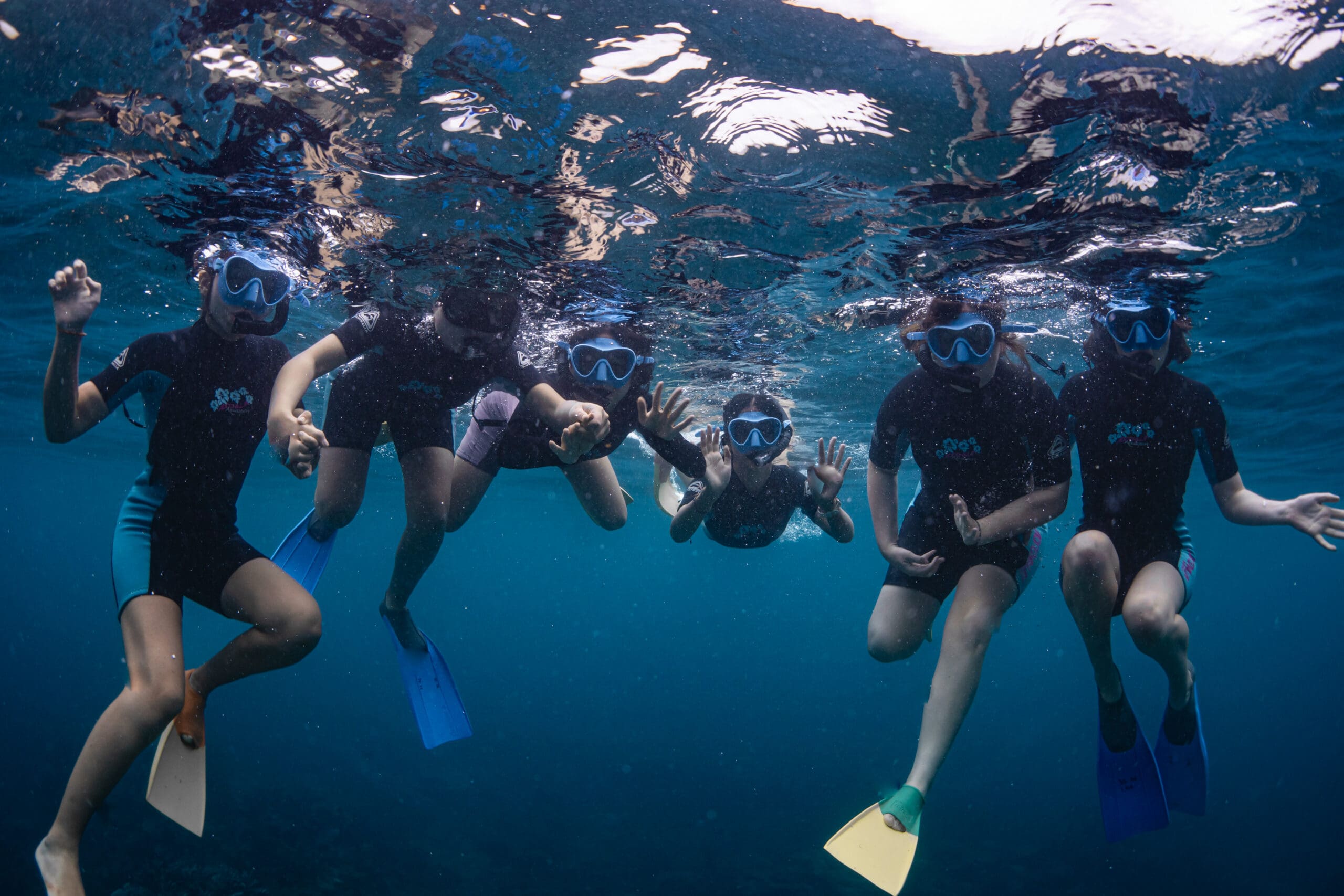 six students scuba diving