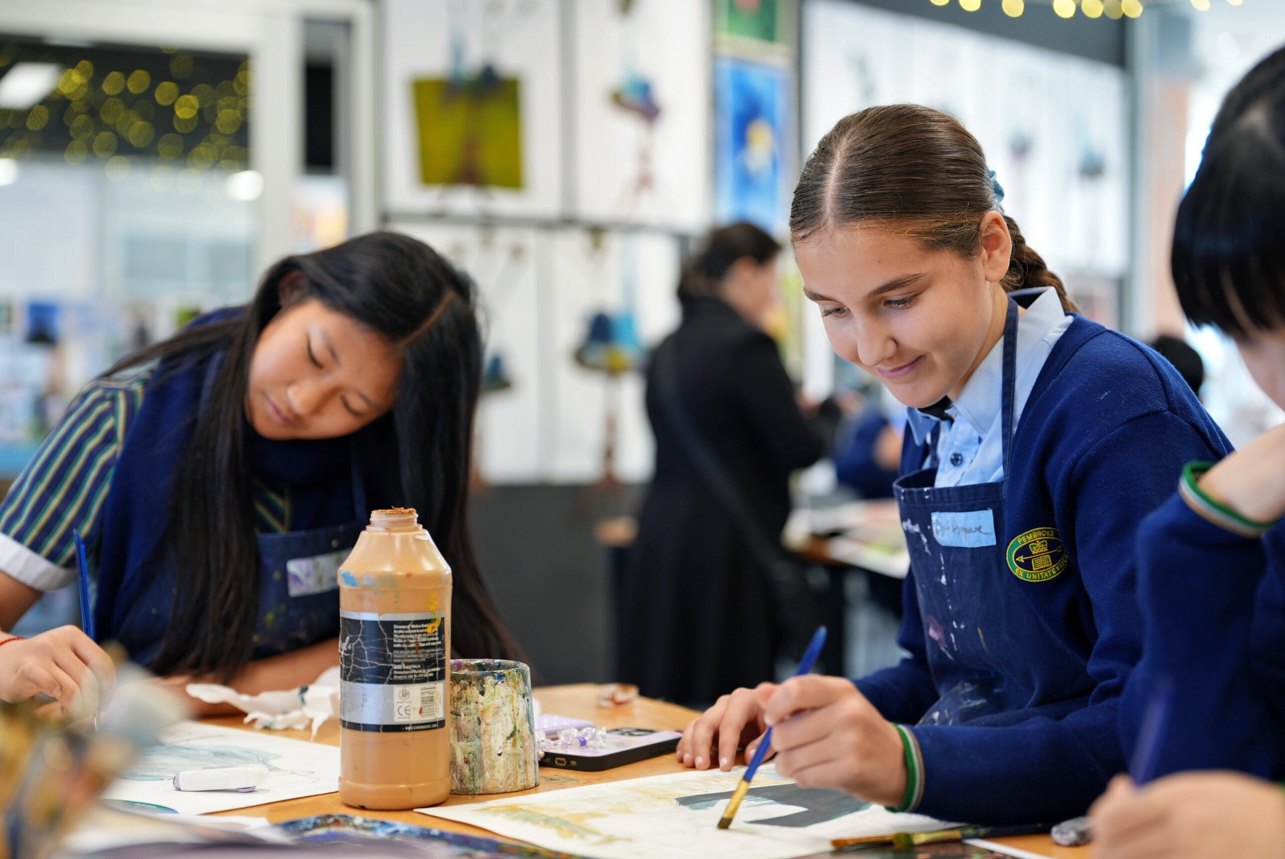two middle school students in art class