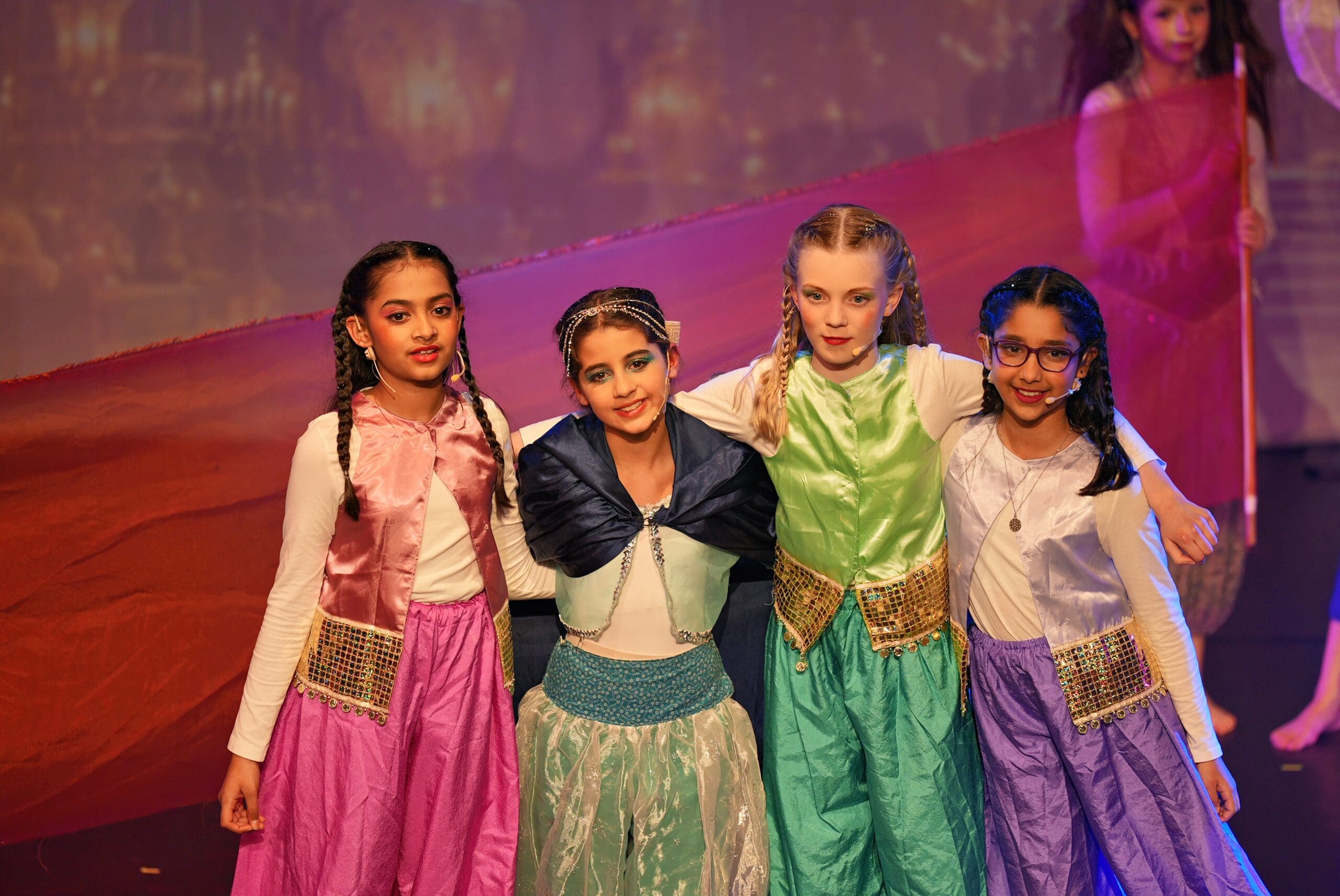 four junior school students during aladdin the musical