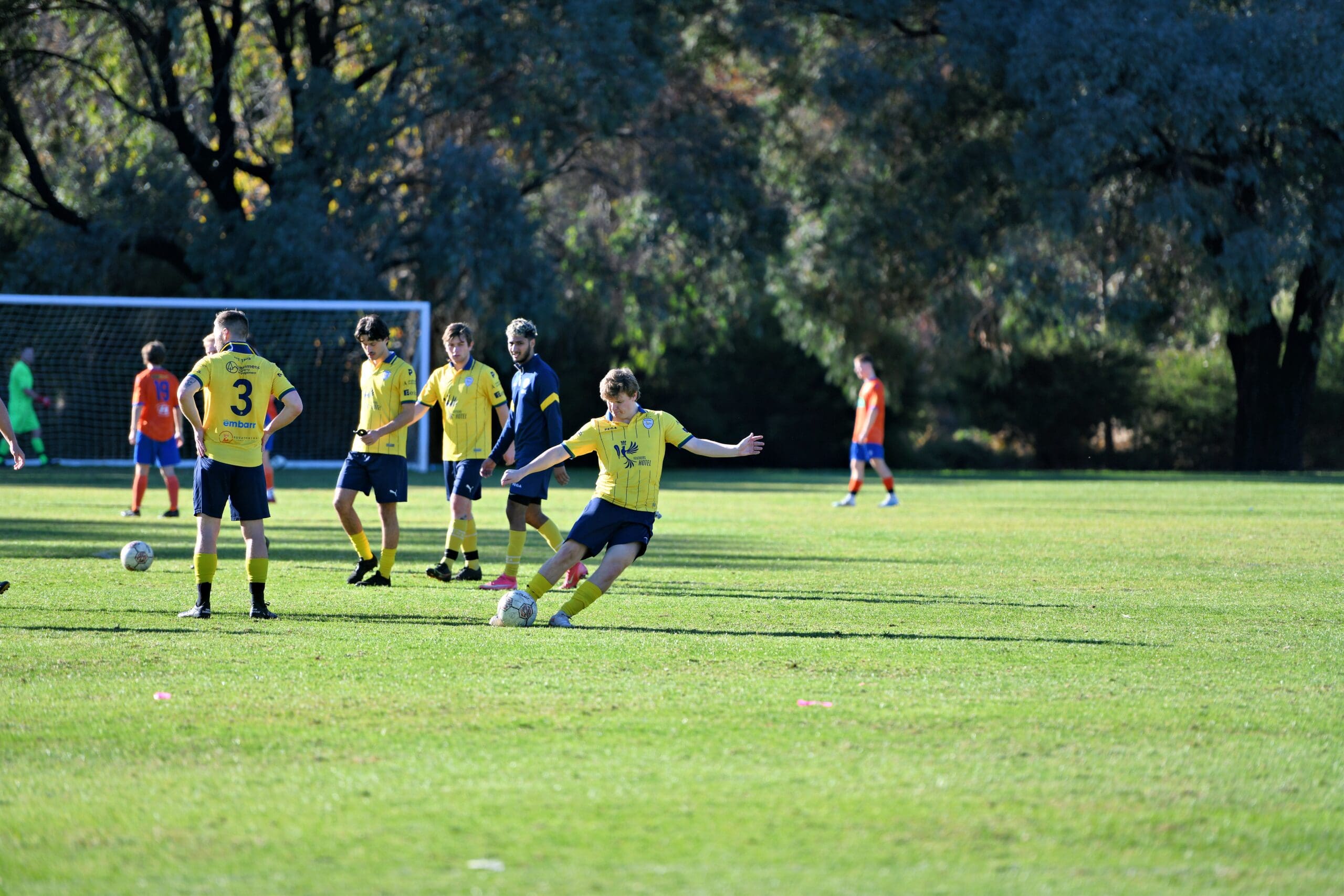 old scholar kicks a ball during mens game