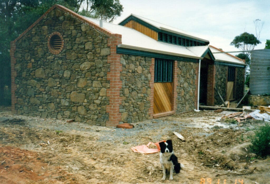 Construction of ablution block at Old Watulunga nearing completion in November 1989. Featuring the stonemason's assistant "Jess the dog".