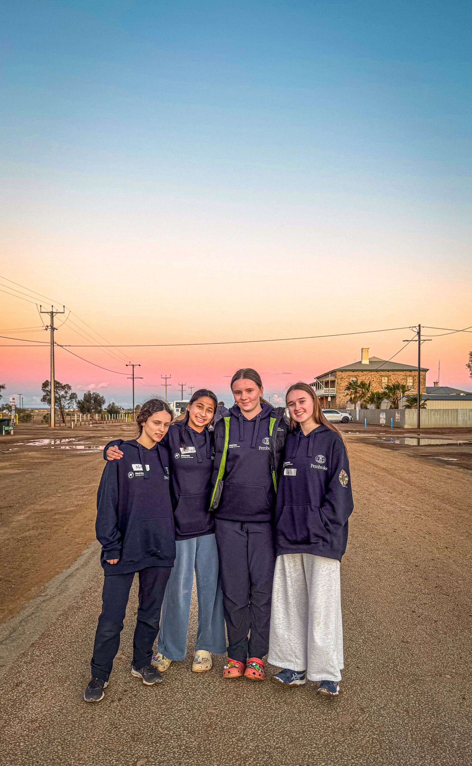 four students posing for a photo in marree during trip