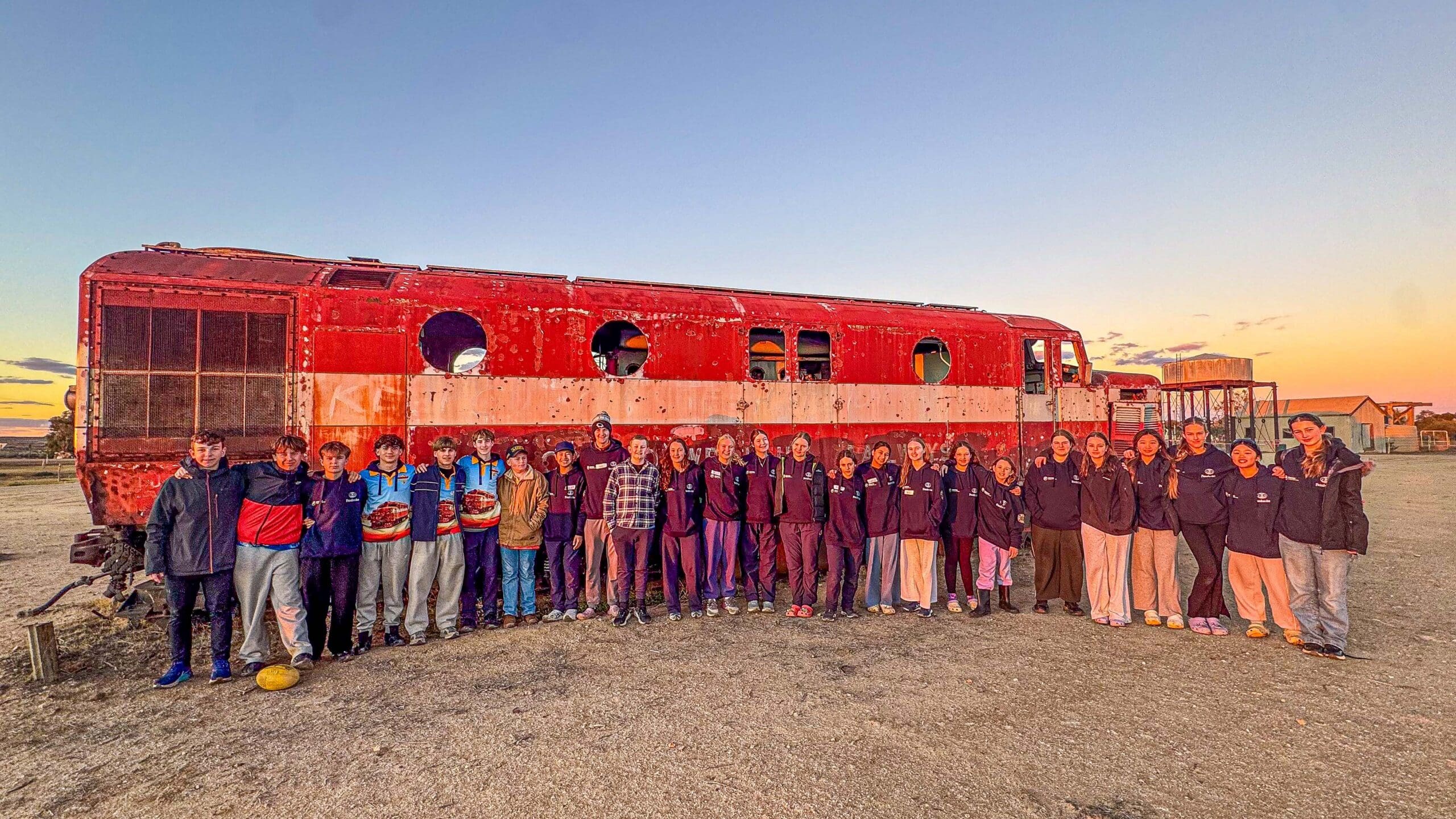 Pembroke Marree Trip 2025 students in front of old locomotive