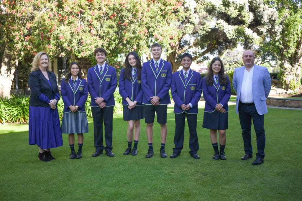 Principal Mark Staker and Head of Senior School Alexandra Piggott with 2026 School Captains outside Bills House Dec 25